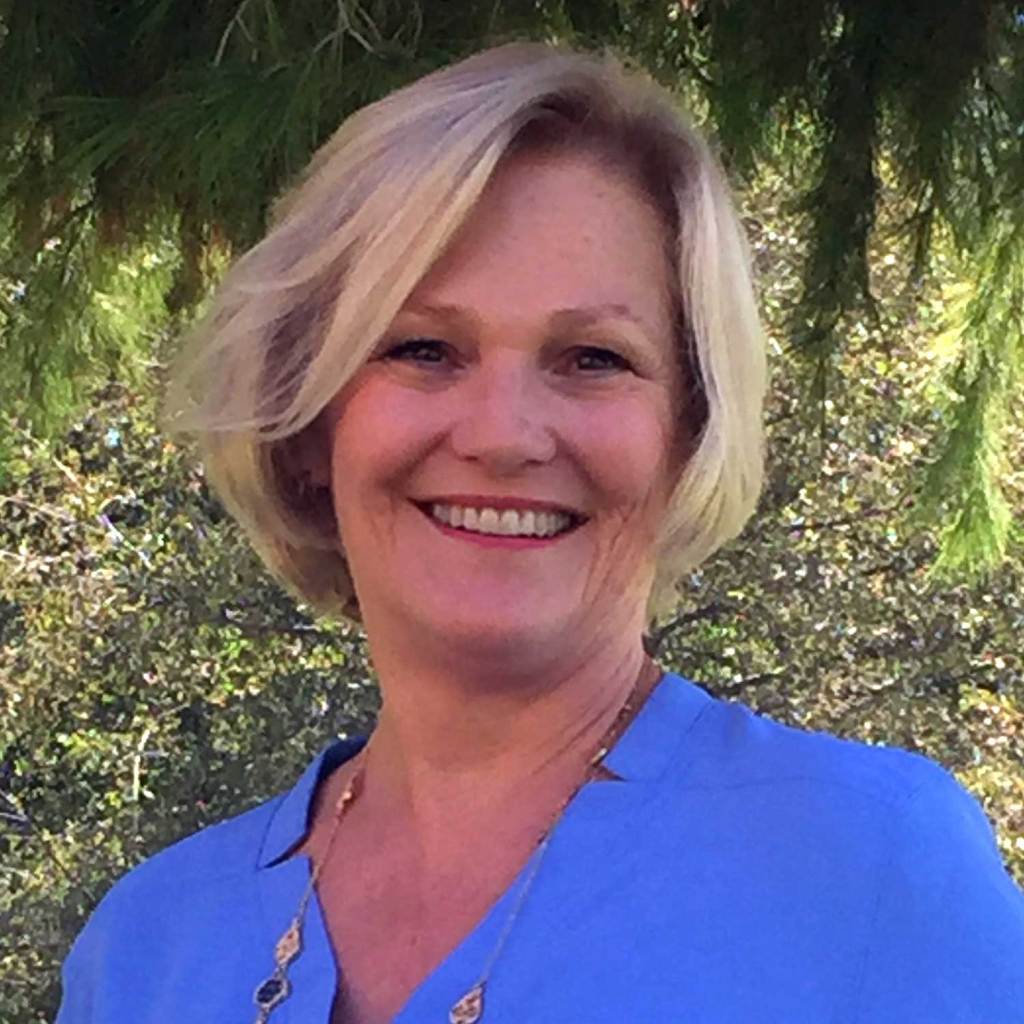 A woman smiling at camera