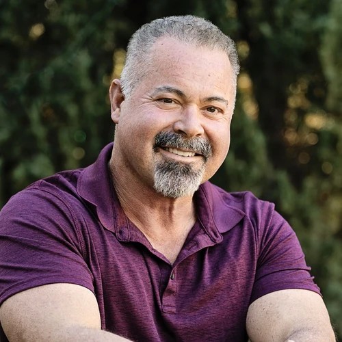 A man in a purple shirt