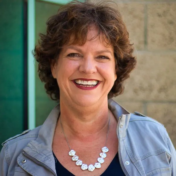 A woman smiling at camera