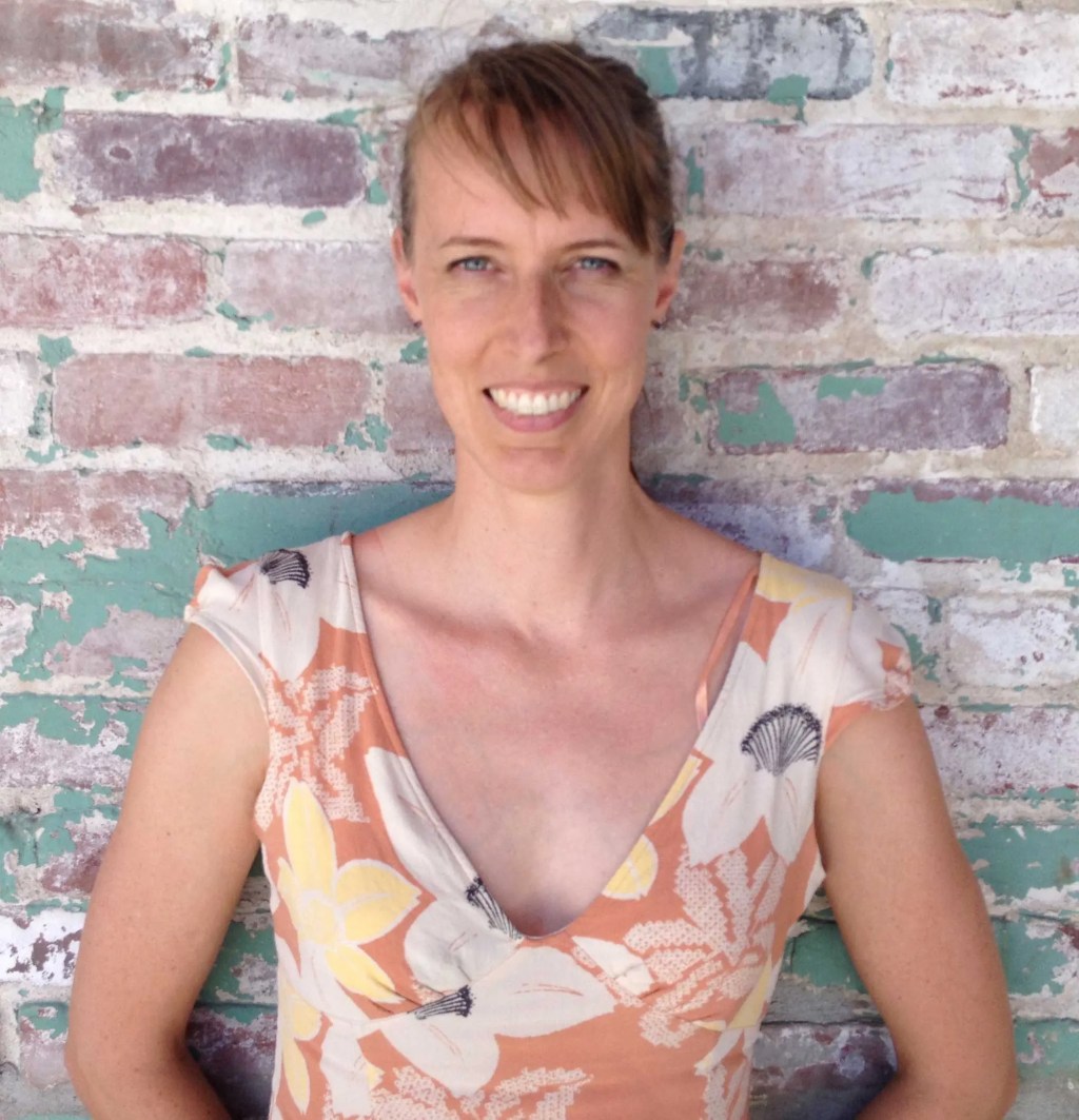 A woman smiling at camera