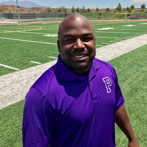 A man standing on a football field