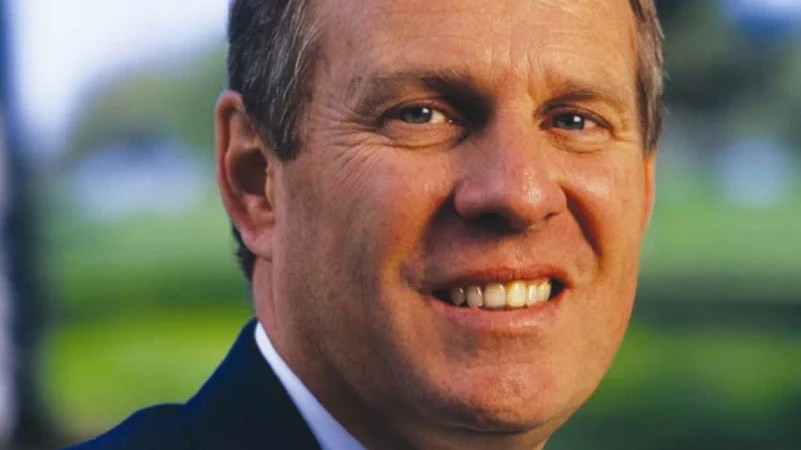 A close-up of a man smiling