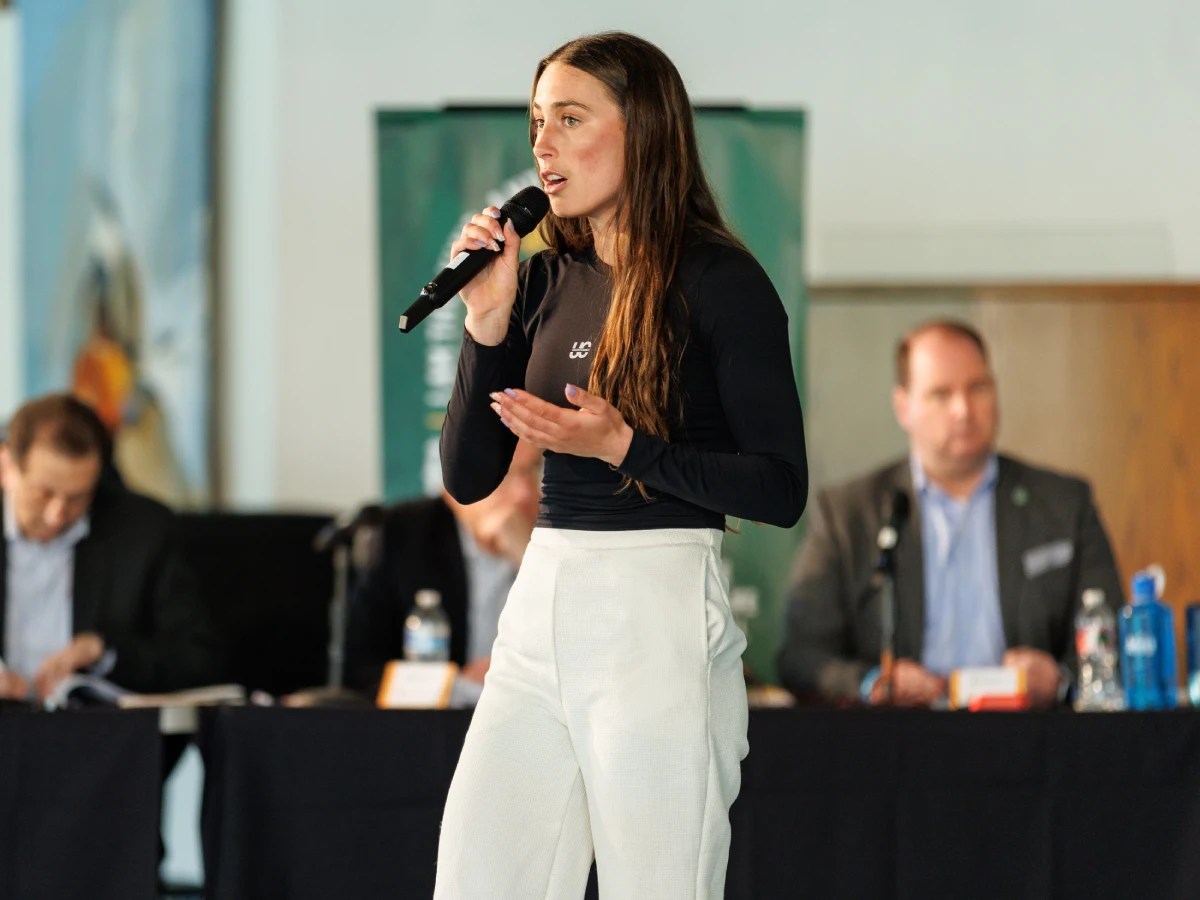 A woman speaking into a microphone