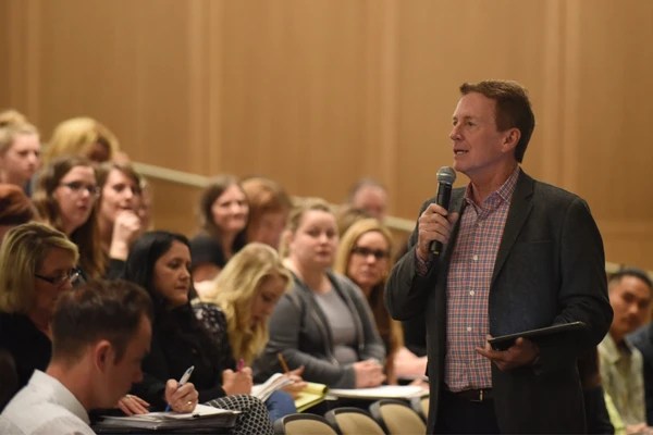 A man standing in front of a crowd of people