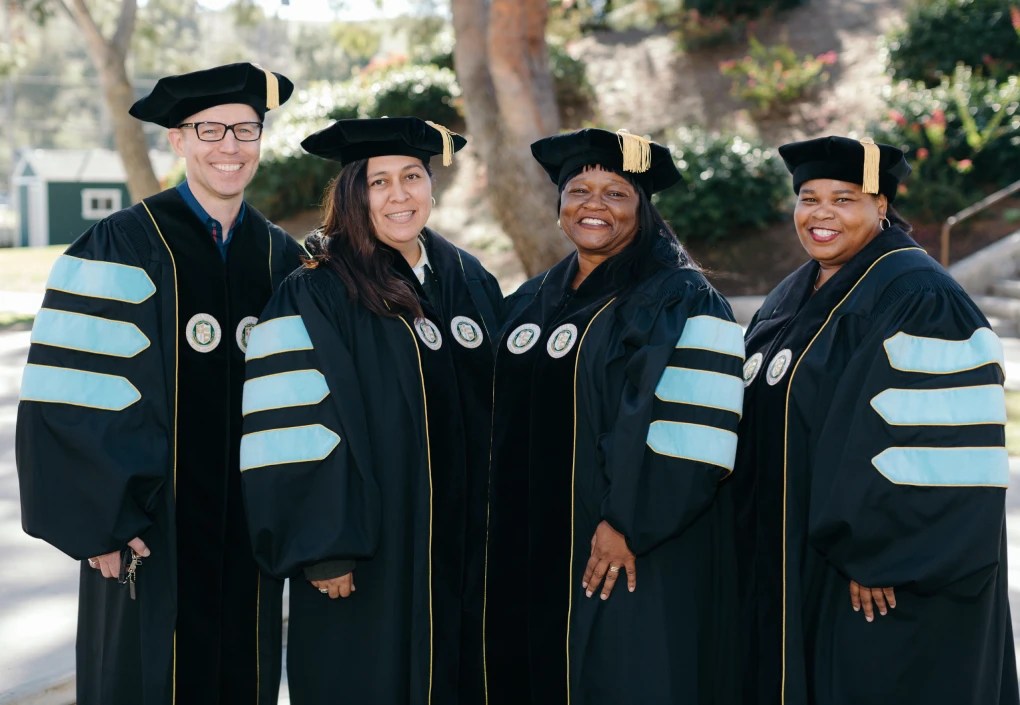 A group of people in graduation gowns