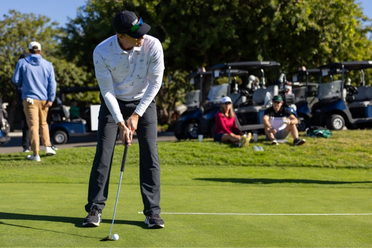 A man playing golf on a golf course