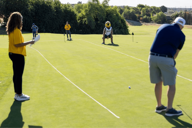 A group of people playing golf