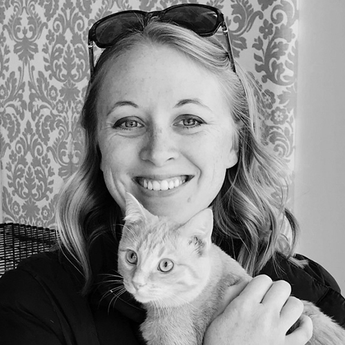 A woman holding a cat