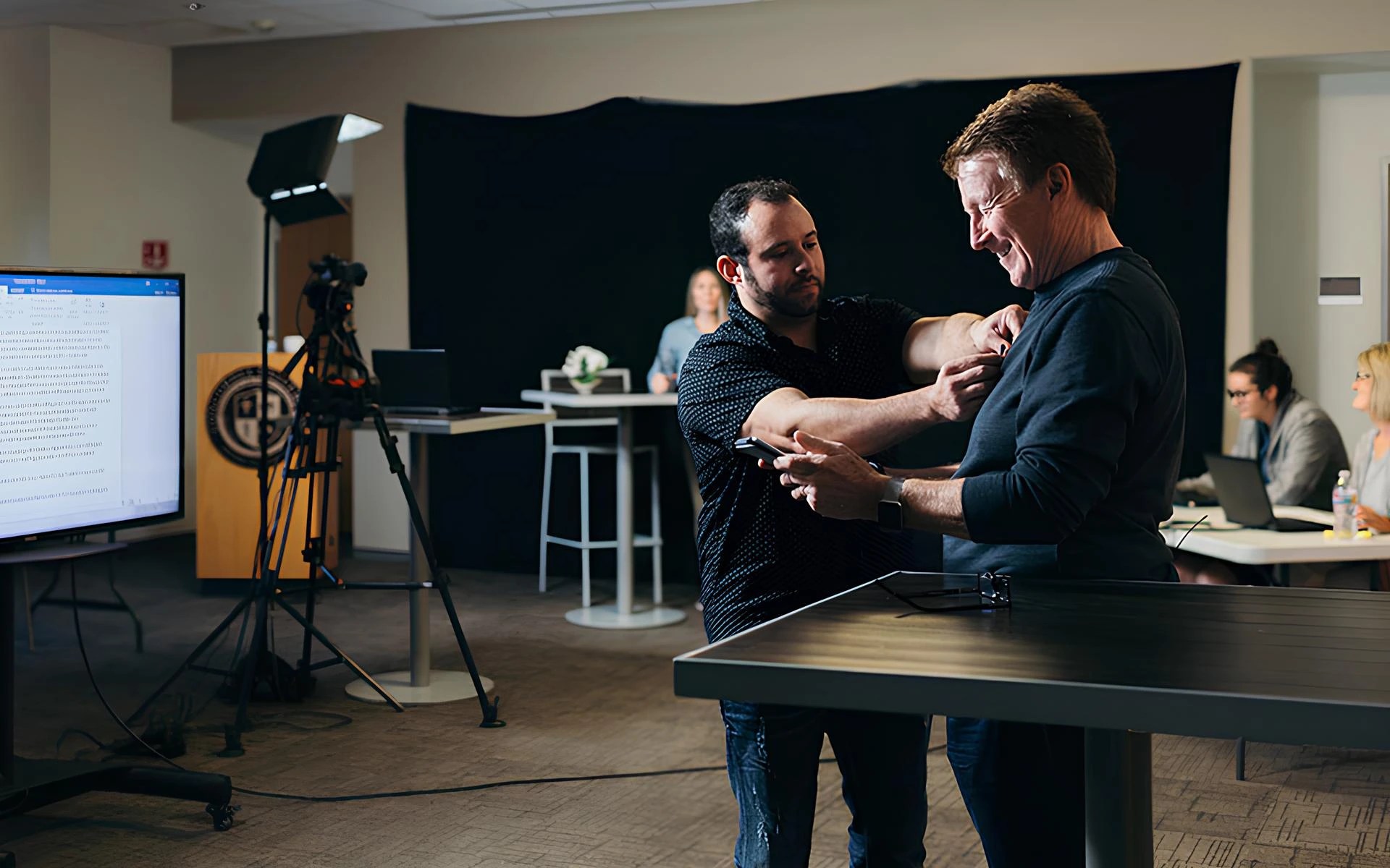 A man holding a man's shirt