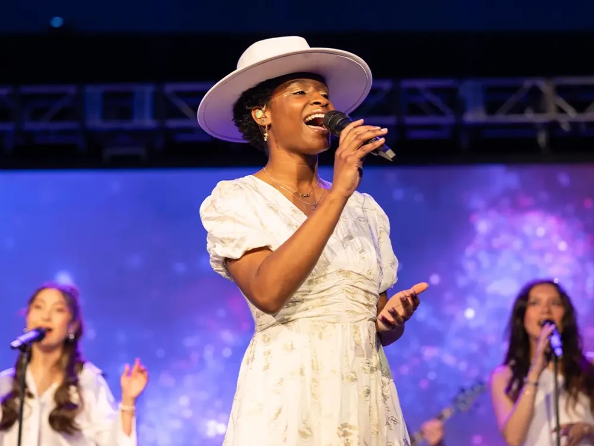 A woman singing into a microphone