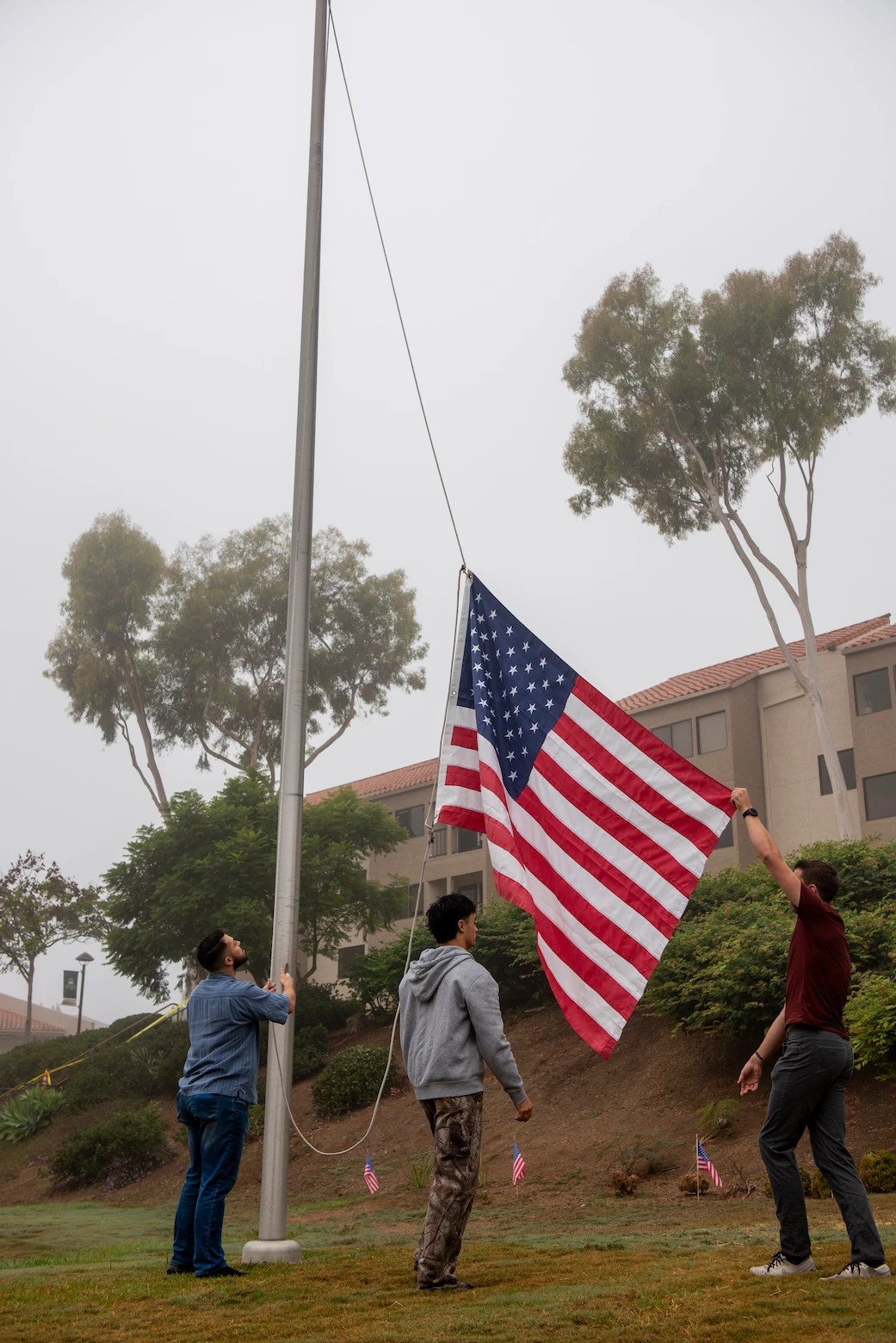 A group of people holding a flag
