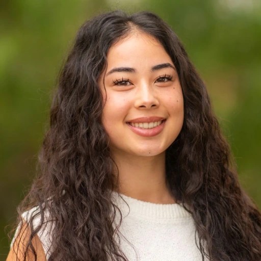 A woman with long hair smiling