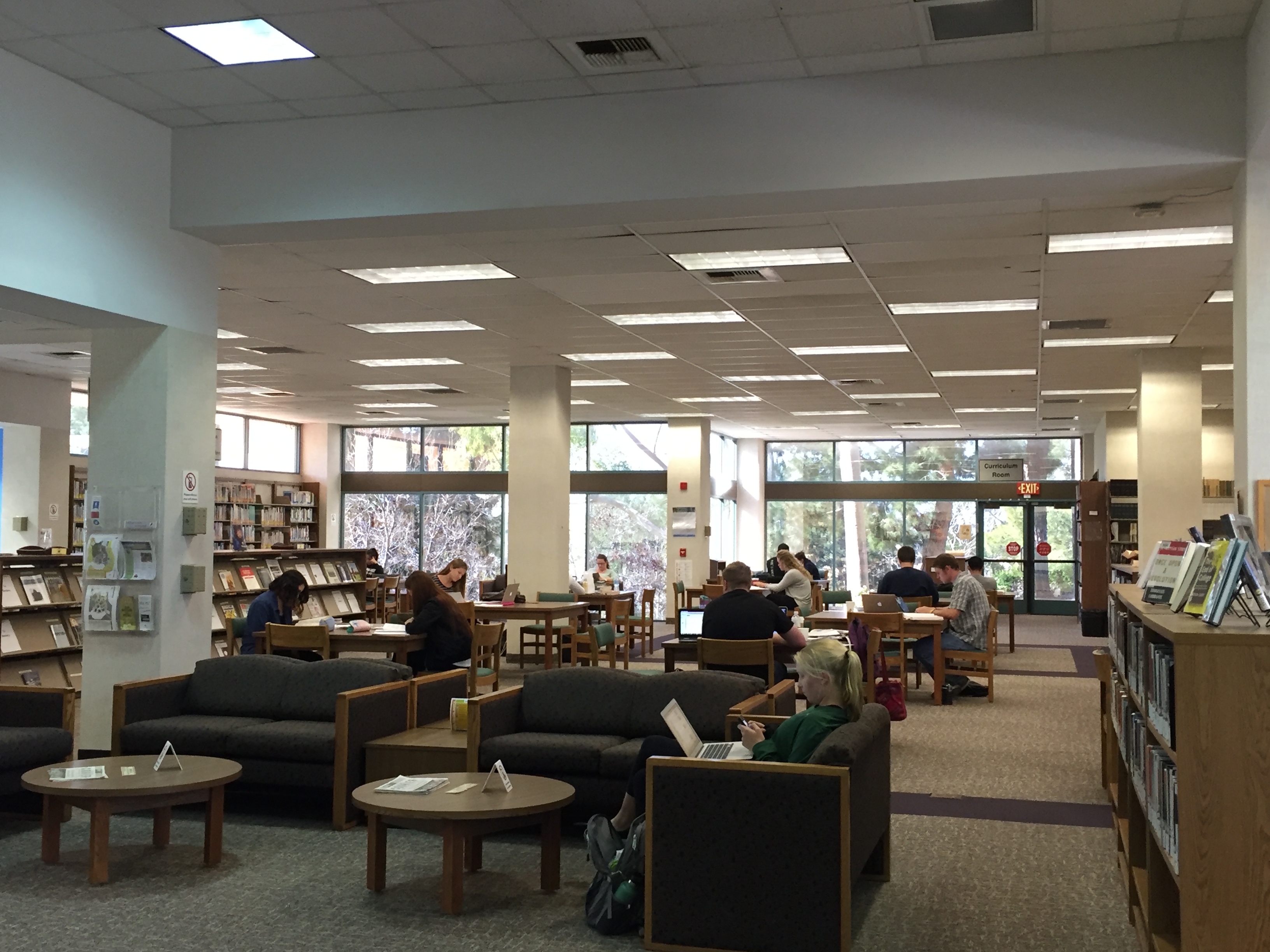 A group of people sitting in a library