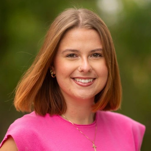 A woman in a pink shirt