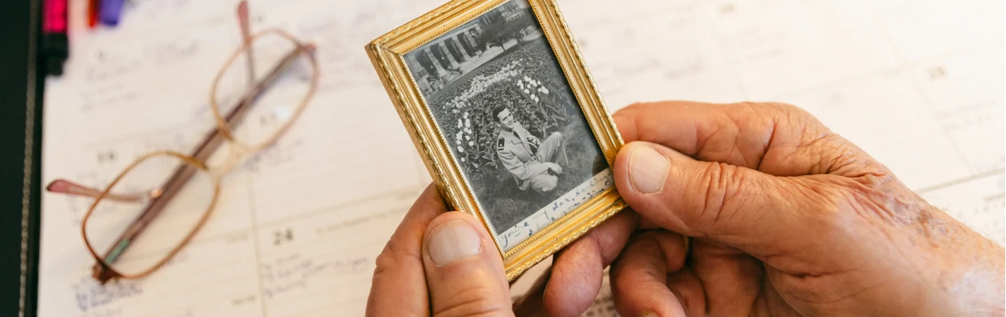 A person holding a picture frame