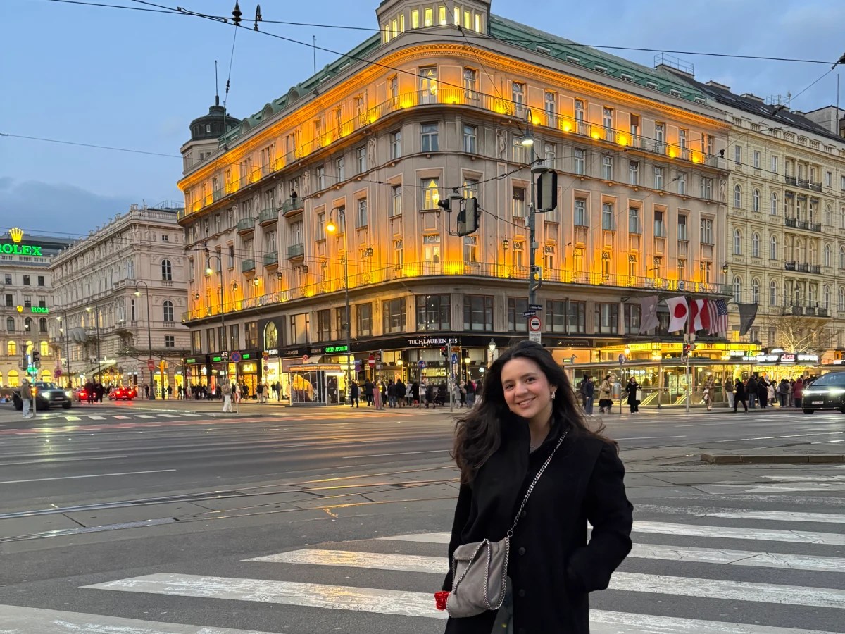 A woman standing in front of a building