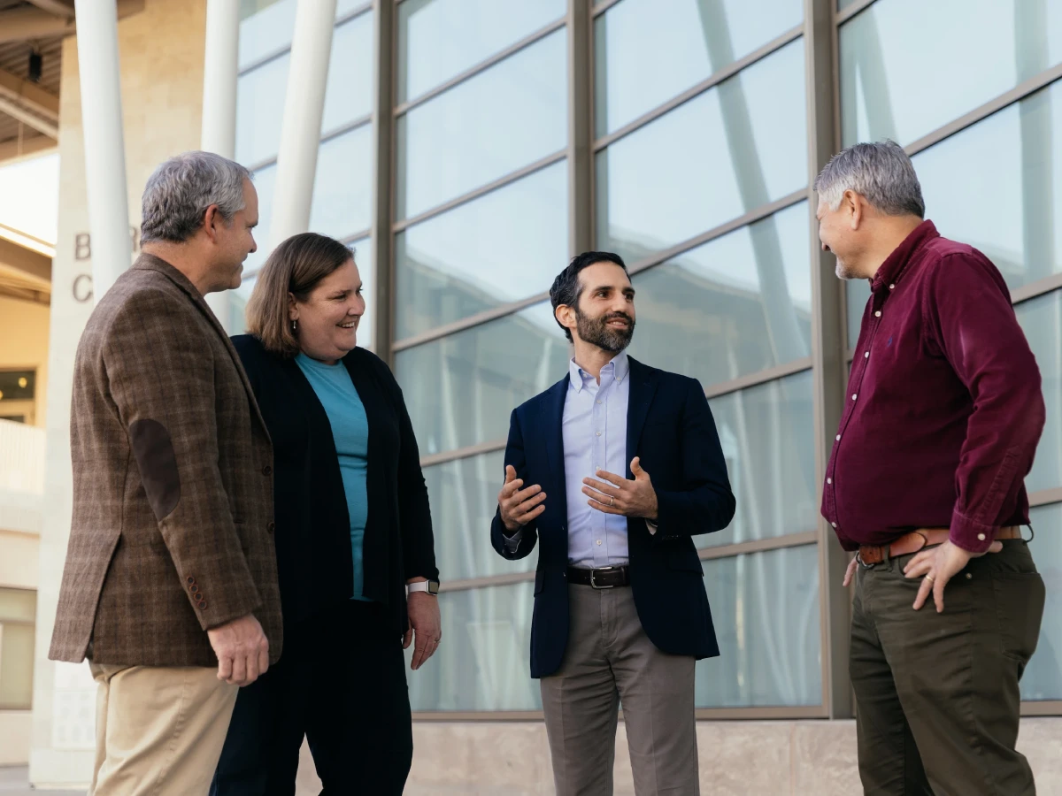 A group of people standing outside a building