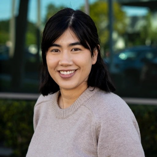 A woman smiling at the camera