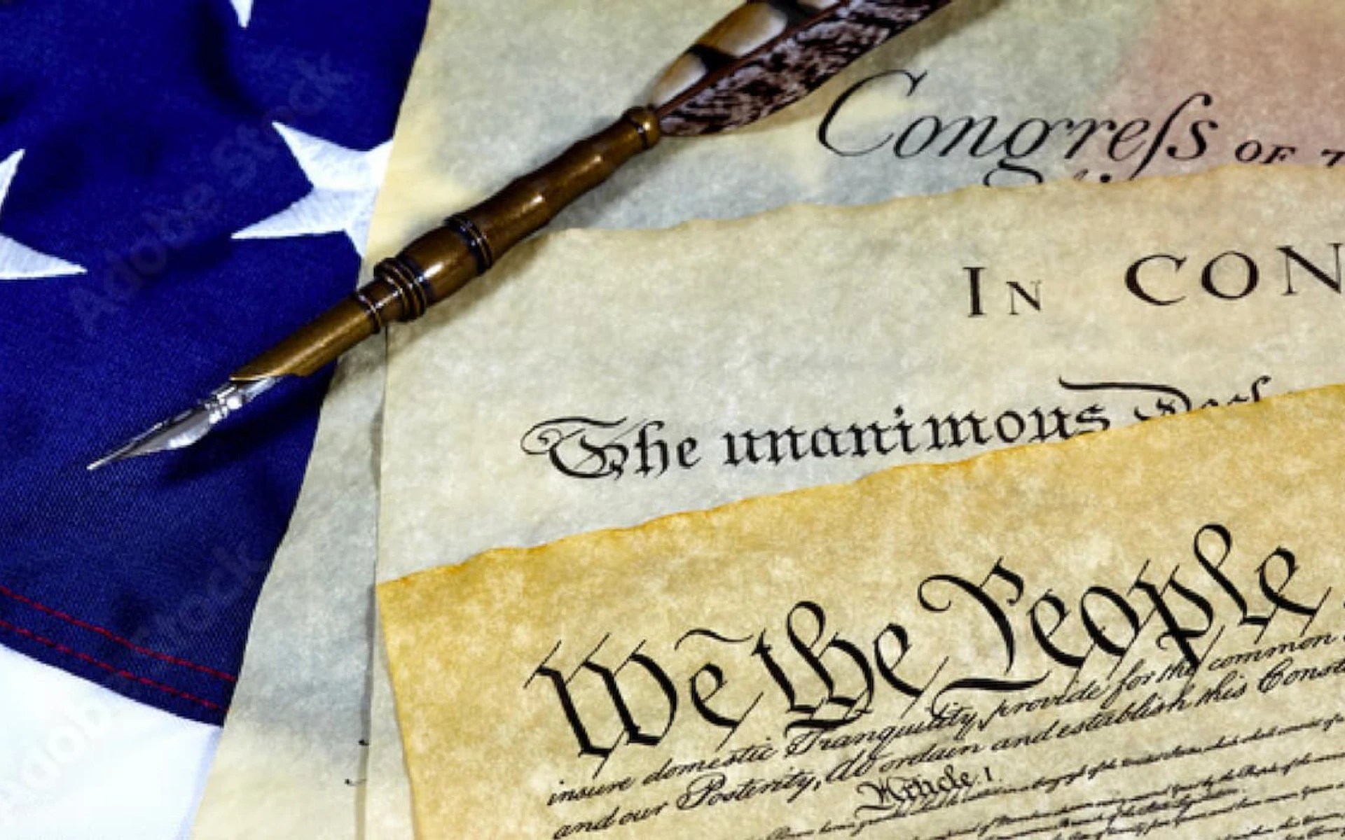 A close-up of a flag and a pen