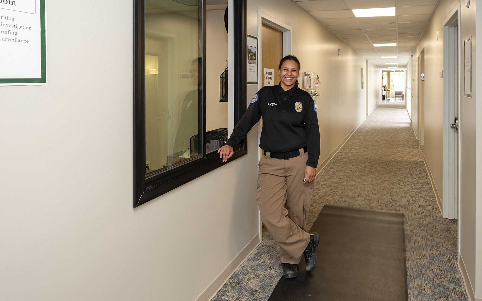 A woman standing in a hallway