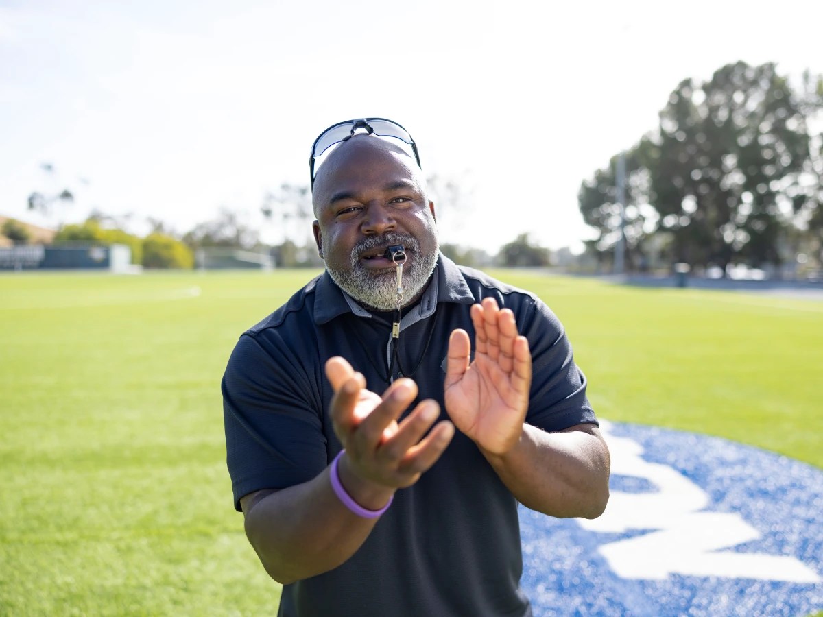 A man holding his hands up