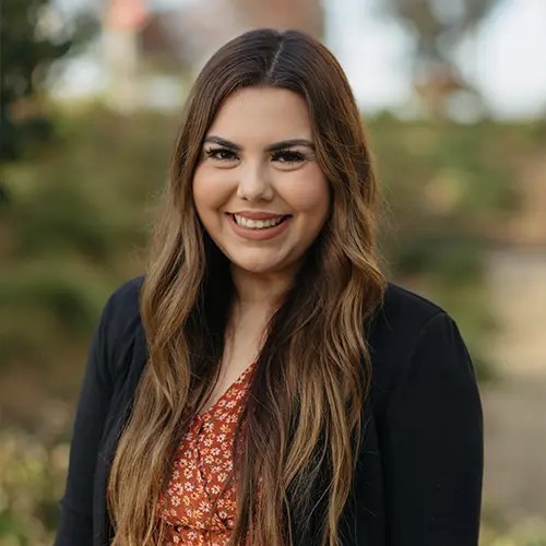 A woman smiling at camera