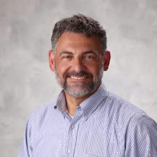 A man smiling at the camera
