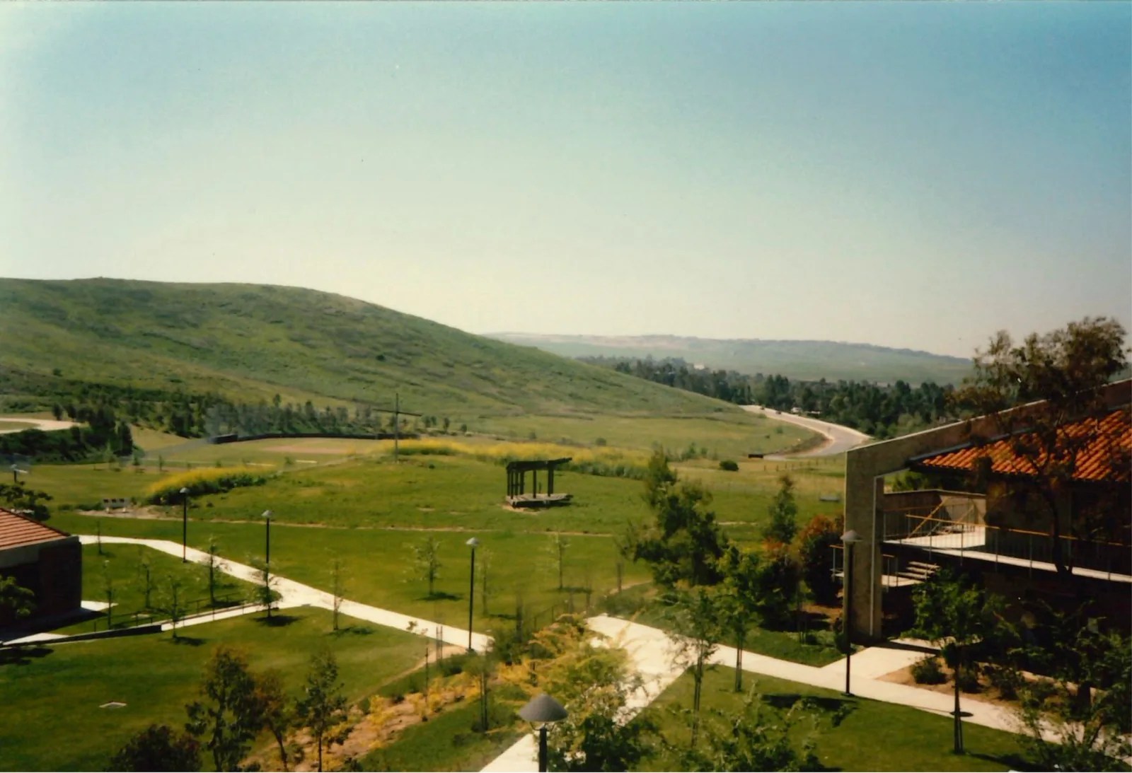 The Bird Sanctuary on green campus grounds, seen from above between walkways and buildings.