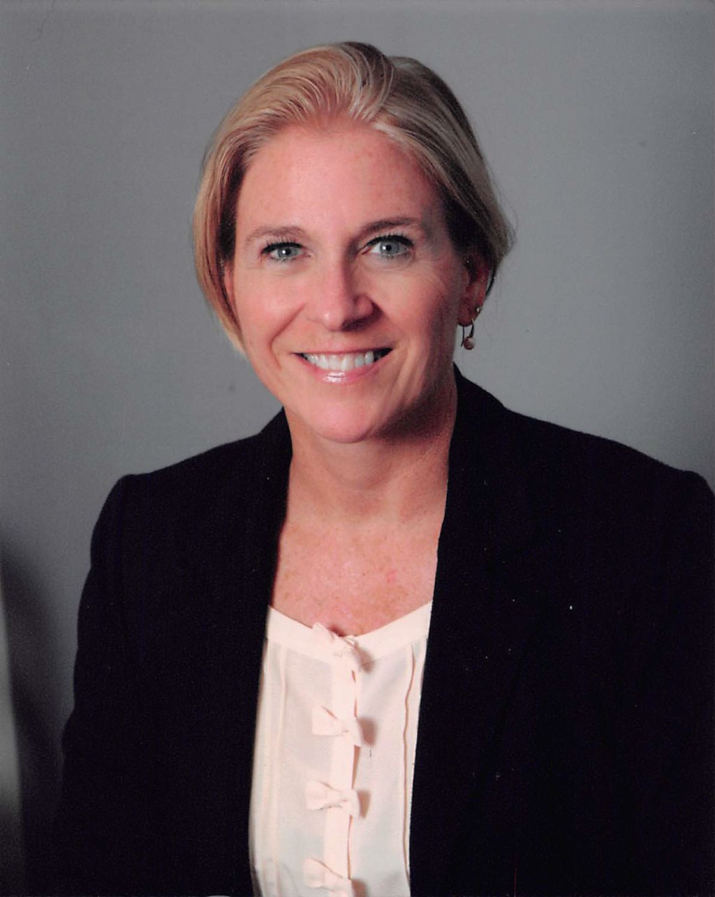 A woman smiling at the camera