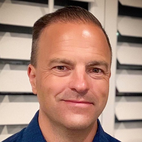 A man smiling for a picture