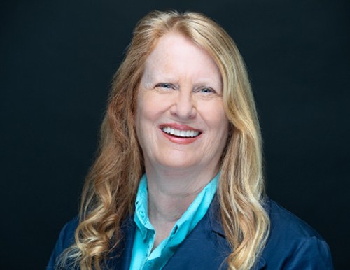 A woman smiling at the camera