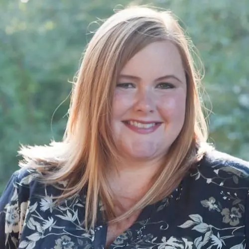 A woman smiling at the camera