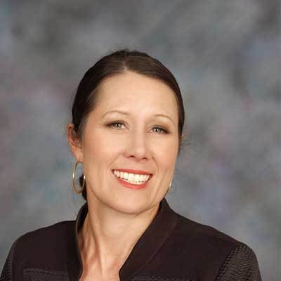 A woman smiling at the camera