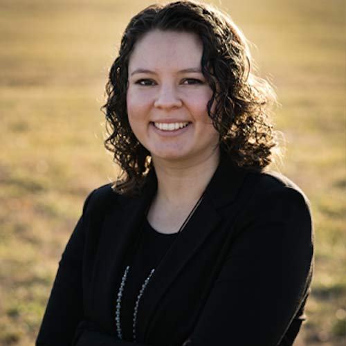 A woman in a black suit