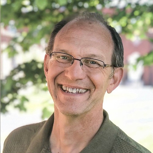 A man smiling for a picture