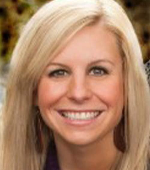A close-up of a woman smiling