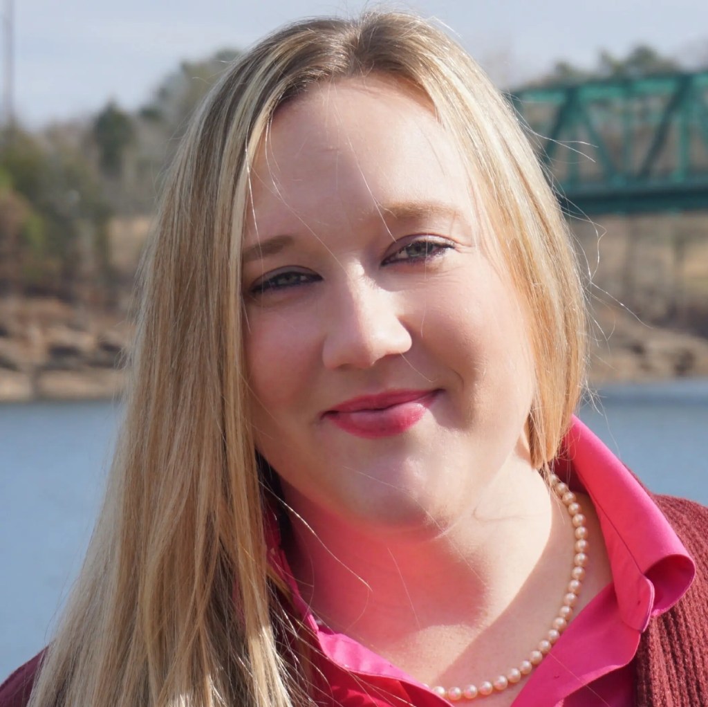 A woman smiling at camera