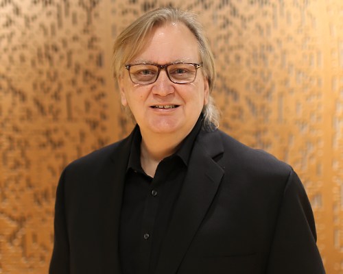A man in a black suit