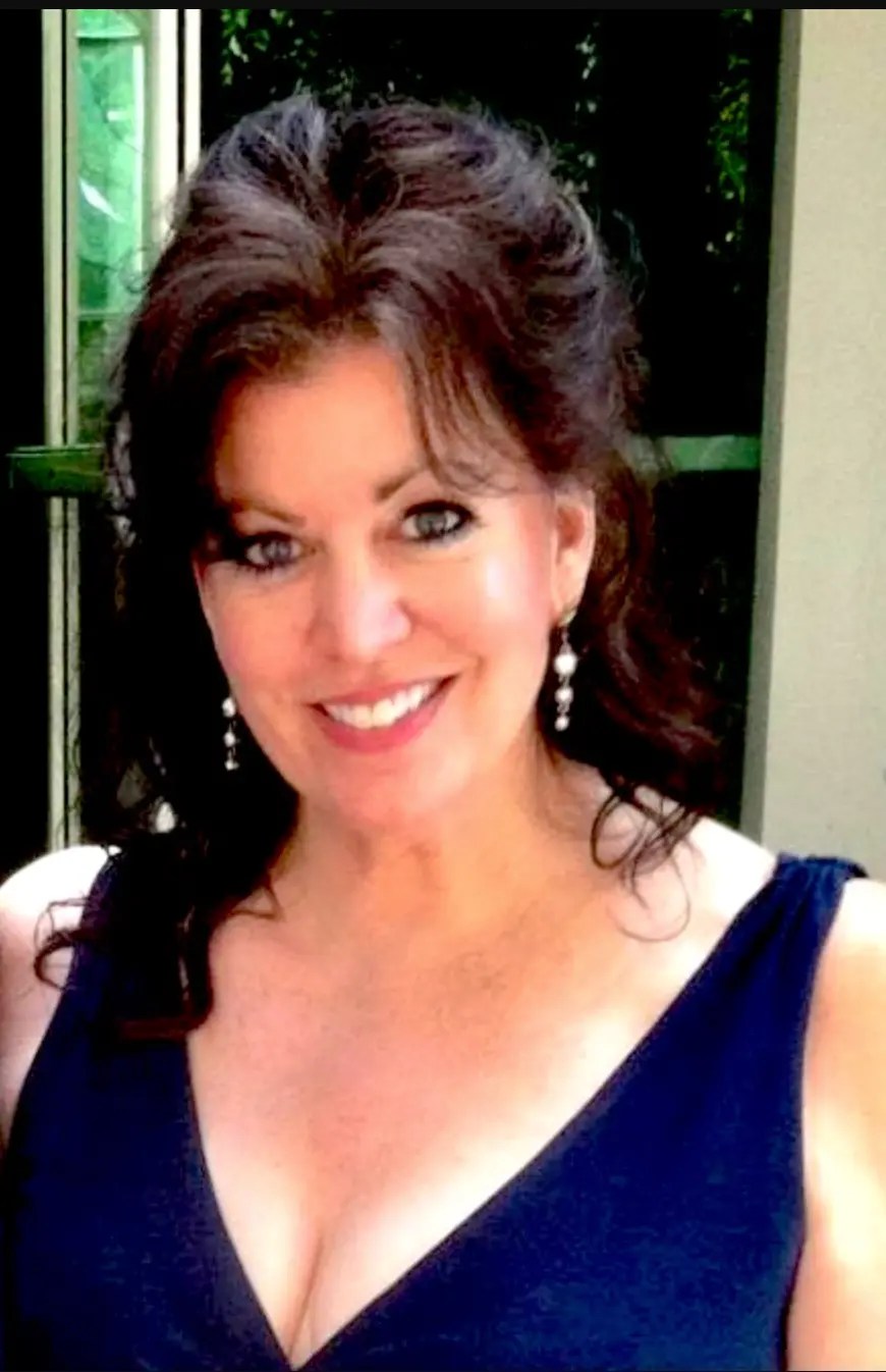 A woman smiling at the camera