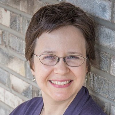 A woman smiling at the camera
